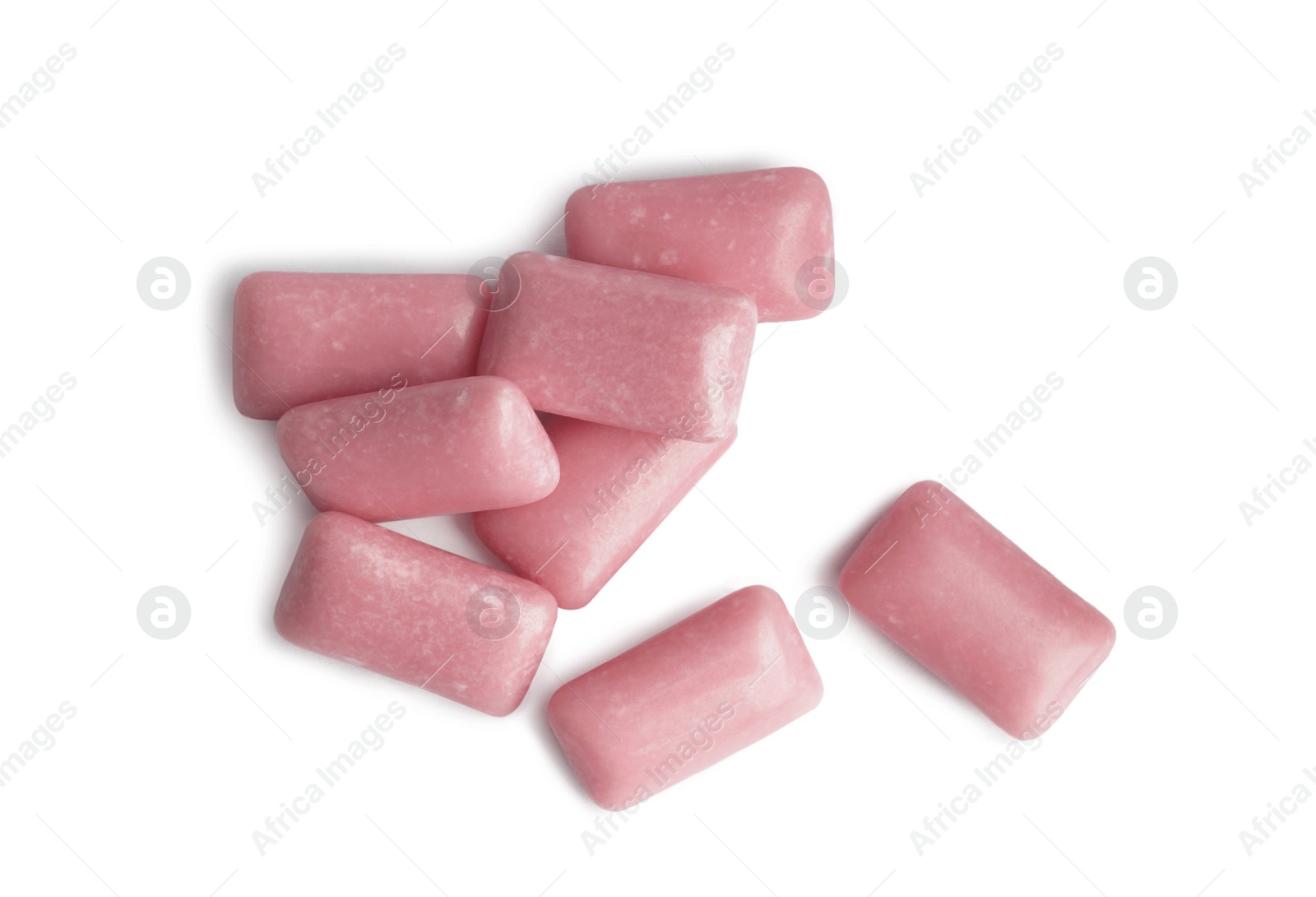 Photo of Heap of tasty sweet chewing gums on white background, top view