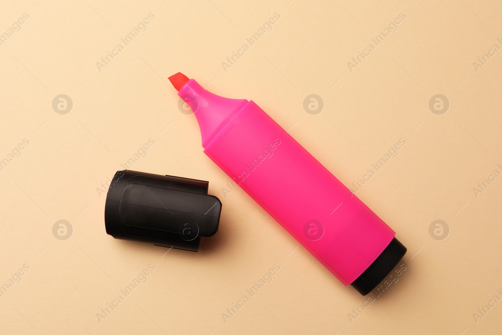 Photo of Bright pink marker on beige background, flat lay