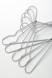 Photo of Many hangers on white background, top view