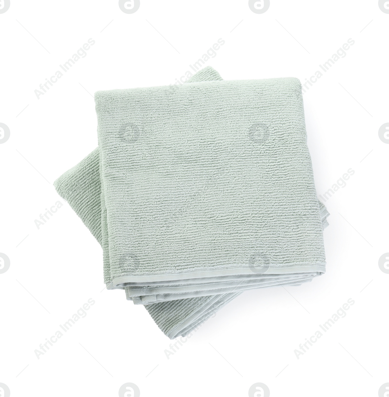 Photo of Soft folded towels isolated on white, top view