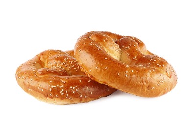 Photo of Tasty freshly baked pretzels on white background