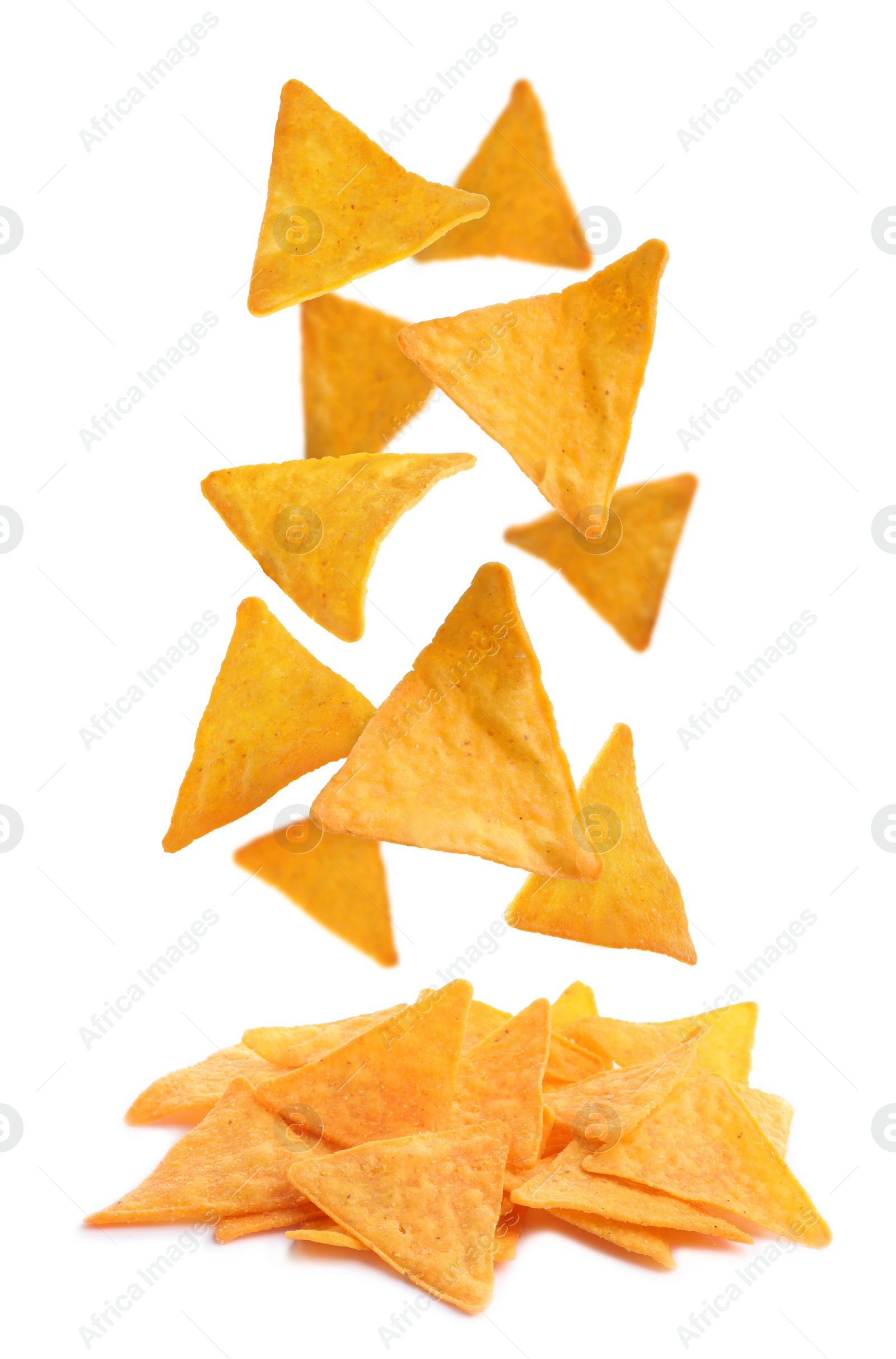 Image of Tasty tortilla chips (nachos) falling into pile on white background