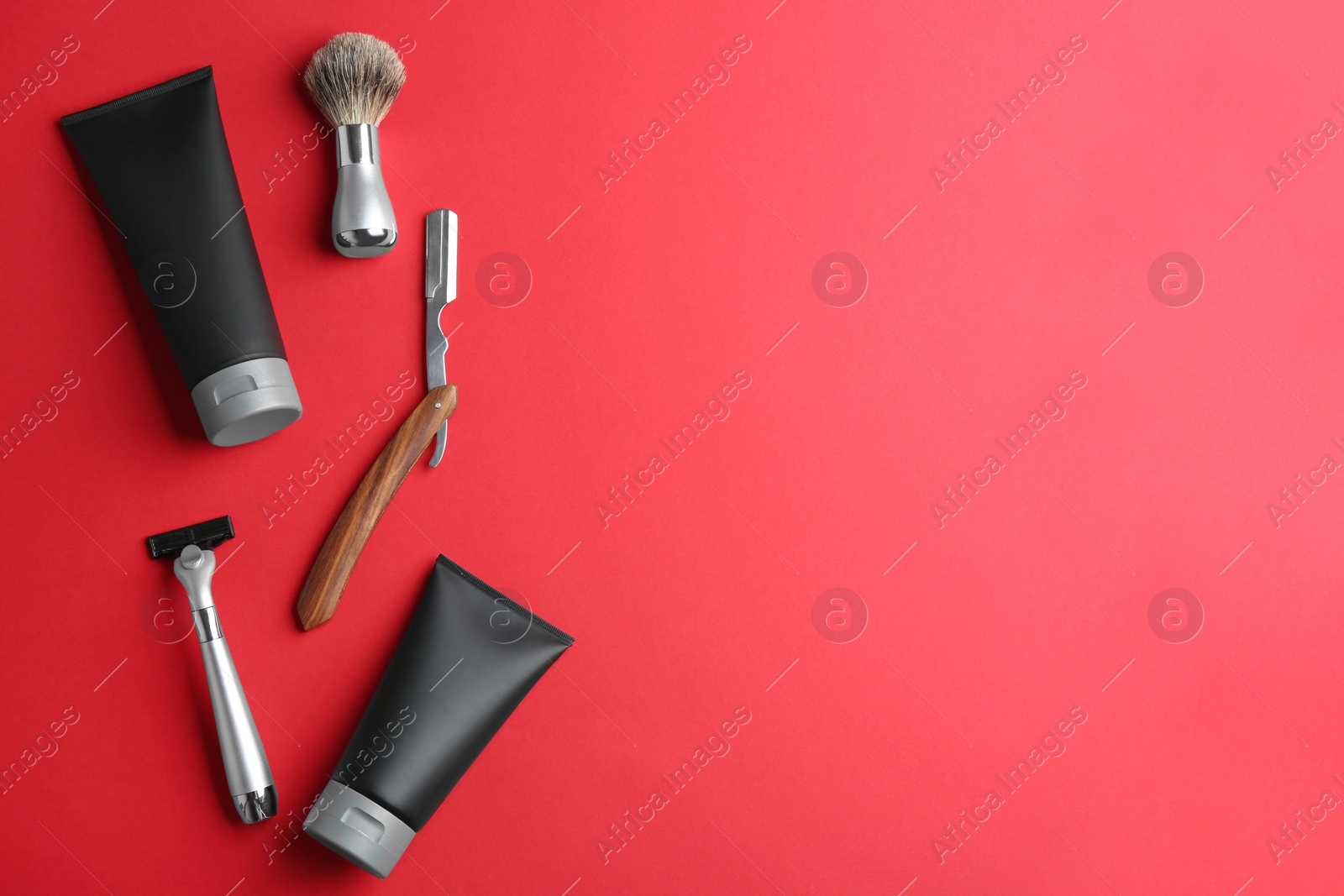 Photo of Set of shaving equipment and men's cosmetic products on color background, flat lay. Space for text