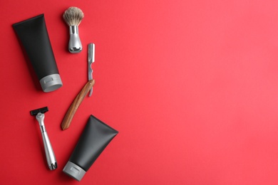 Photo of Set of shaving equipment and men's cosmetic products on color background, flat lay. Space for text