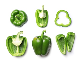 Whole and cut green bell peppers on white background, top view