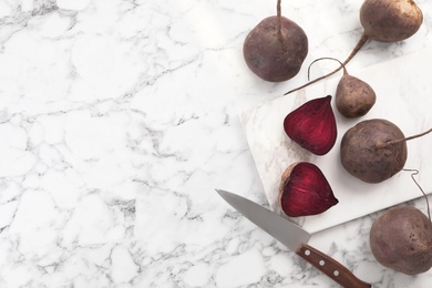 Photo of Flat lay composition with ripe beets on marble background