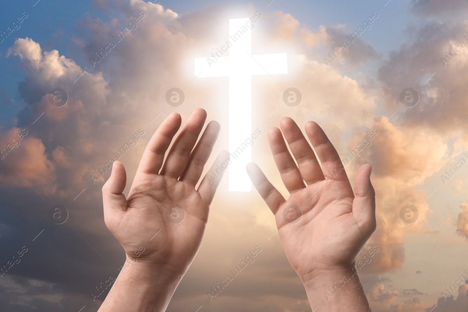 Image of Religion. Christian man praying against sky with glowing cross, closeup