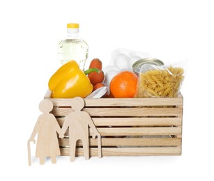 Photo of Humanitarian aid for elderly people. Wooden crate with donation food and figures of couple isolated on white