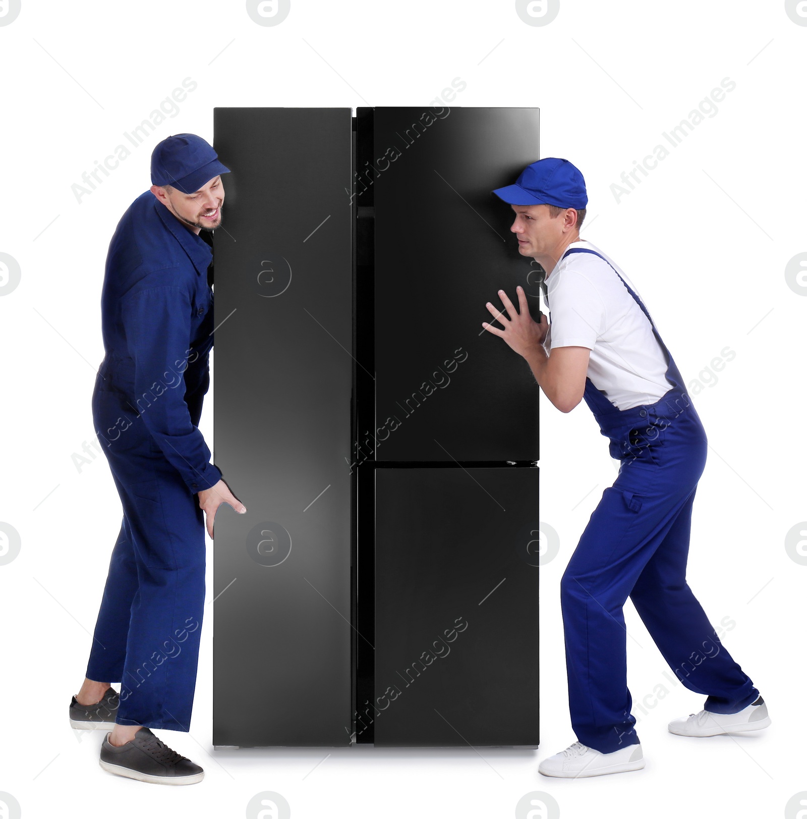 Photo of Professional workers carrying refrigerator on white background