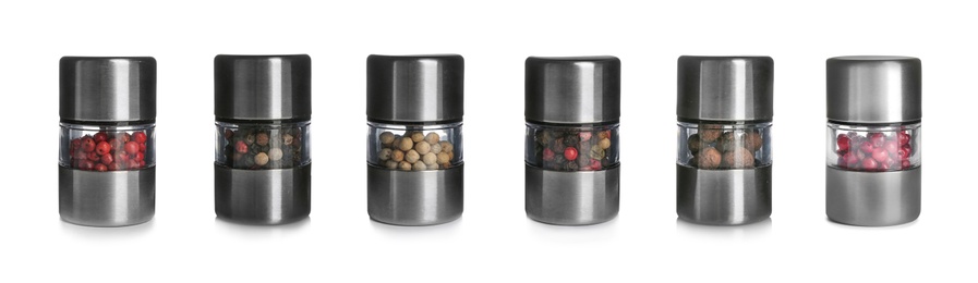 Image of Set of grinders with different peppercorns on white background. Banner design 