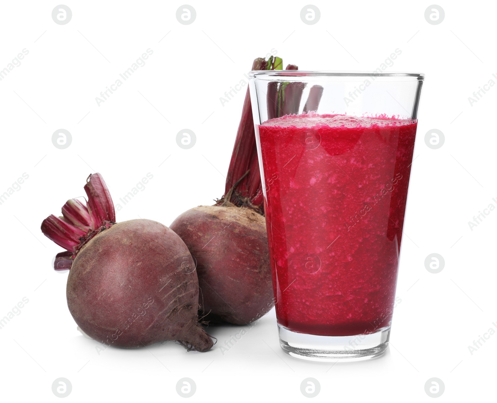 Photo of Glass of beet juice and fresh vegetable on white background