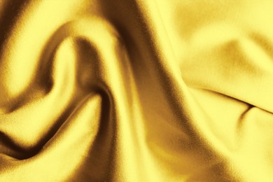 Image of Texture of delicate golden fabric as background, closeup