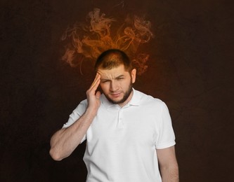 Man having headache on brown background. Illustration of fire representing severe pain