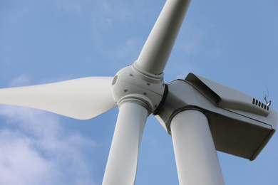 Photo of Wind turbine against beautiful sky, closeup. Alternative energy source