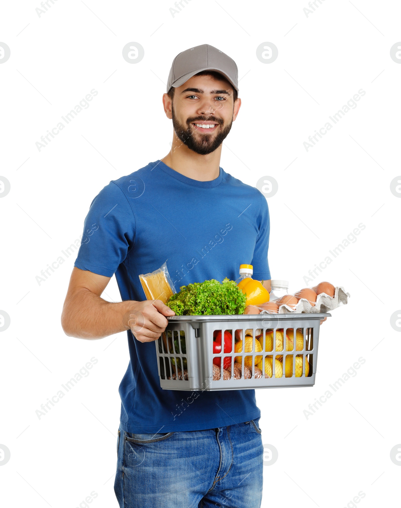 Photo of Man holding basket with fresh products on white background. Food delivery service