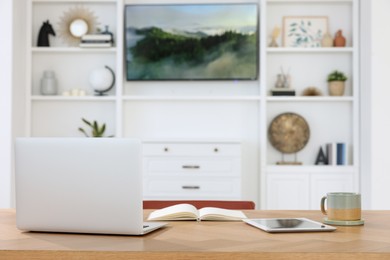 Interior design. Cosy workplace near tv area with shelves