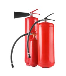 Photo of Three red fire extinguishers on white background