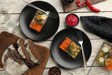 Photo of Delicious aspic, bread and sauce served on white wooden table, flat lay