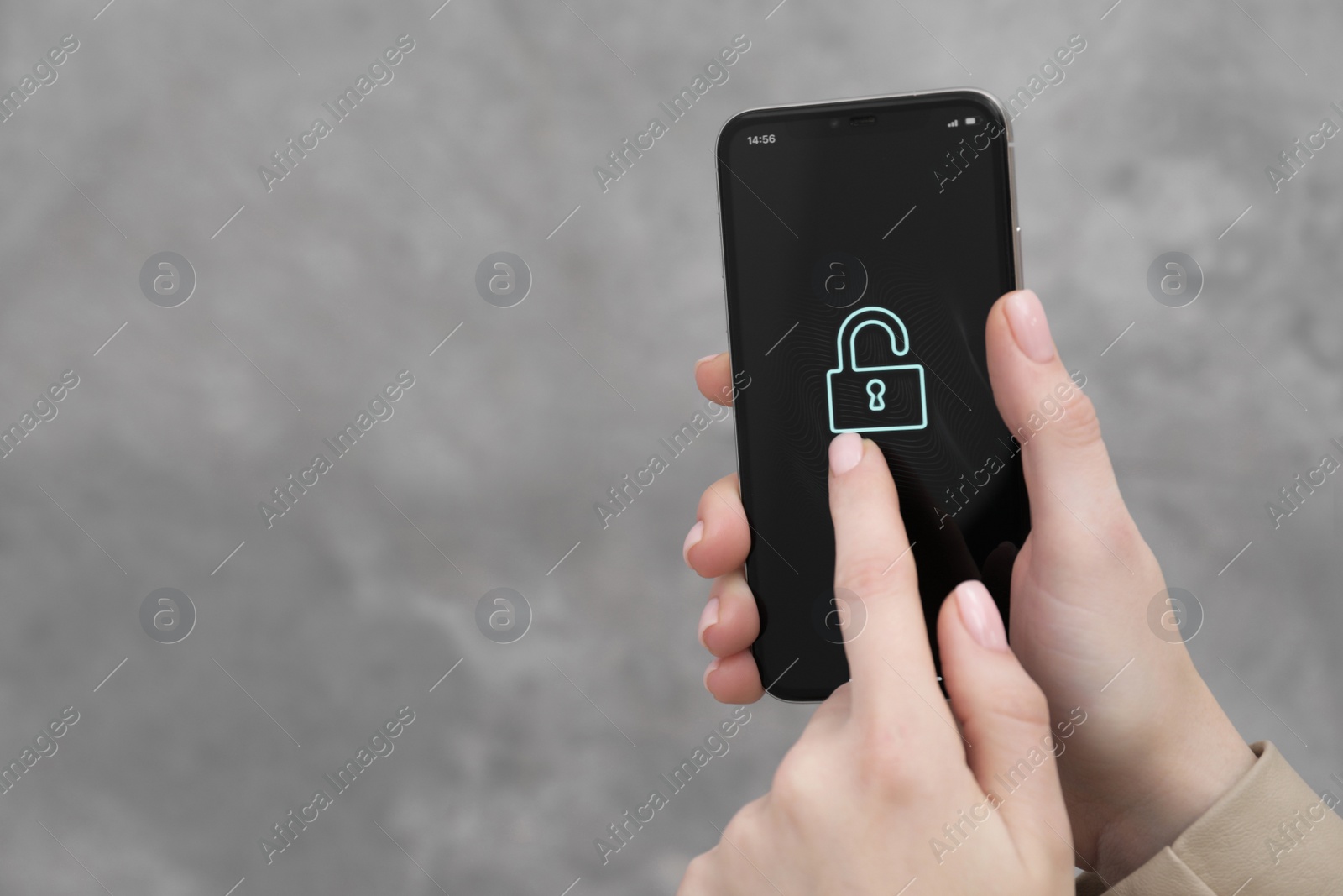 Photo of Woman holding smartphone with blocked screen on grey background, closeup. Space for text