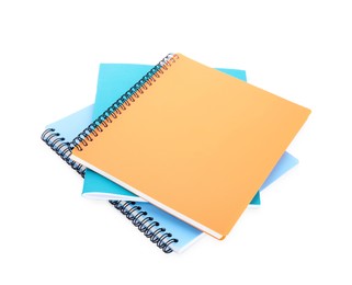 Photo of Many different notebooks isolated on white. School stationery