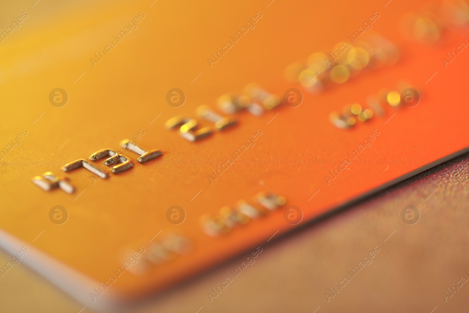 Photo of Plastic credit card on table, macro view