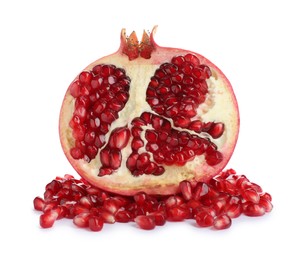 Photo of Ripe fresh pomegranate half with juicy seeds on white background