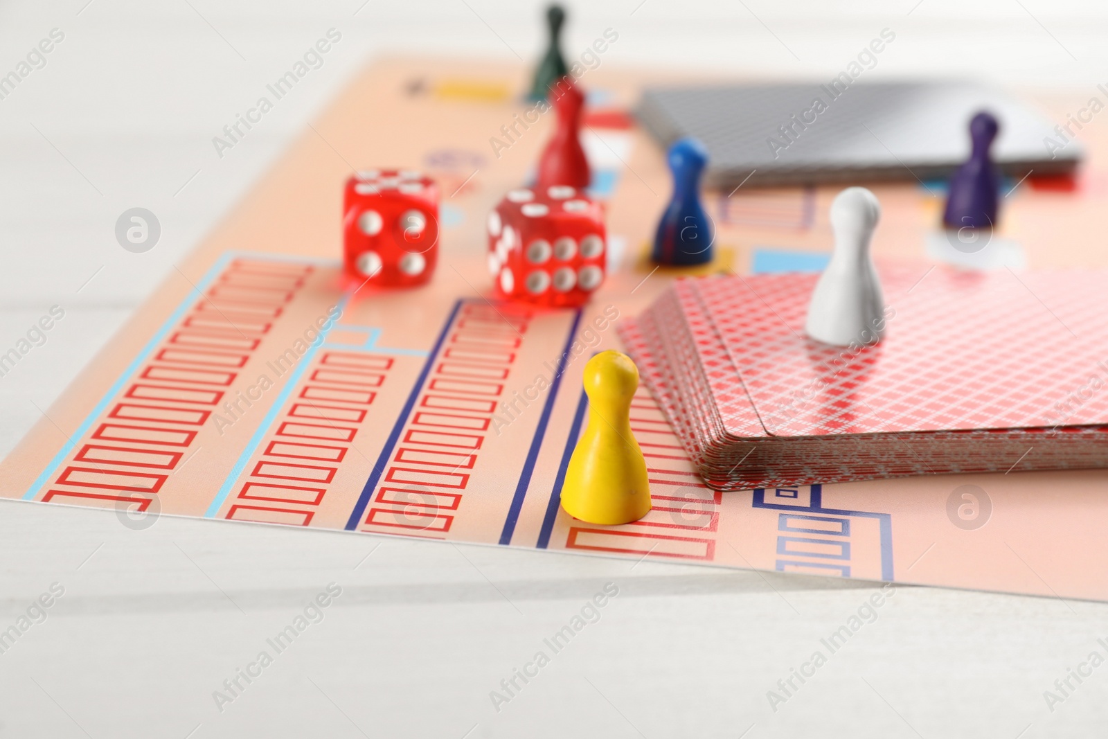 Photo of Board game on white wooden table, closeup