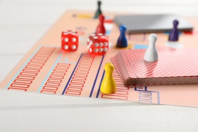 Photo of Board game on white wooden table, closeup