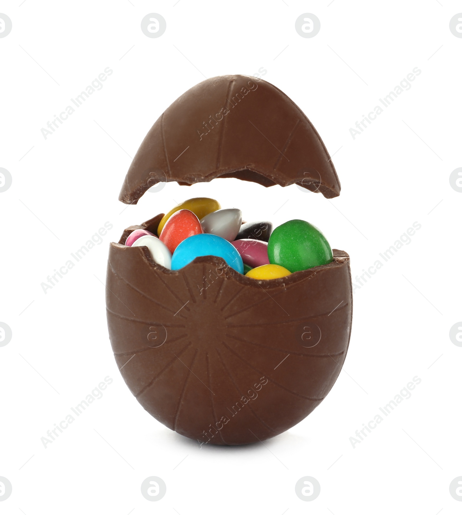 Photo of Broken chocolate egg with colorful candies on white background