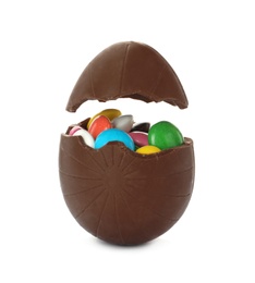 Photo of Broken chocolate egg with colorful candies on white background