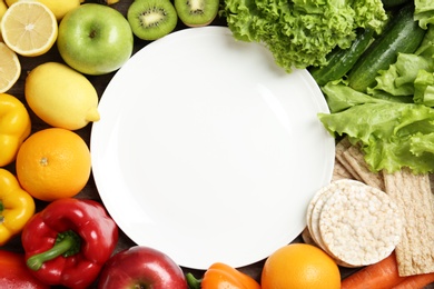 Photo of Flat lay composition with healthy food and empty plate, space for text. Concept of weight loss