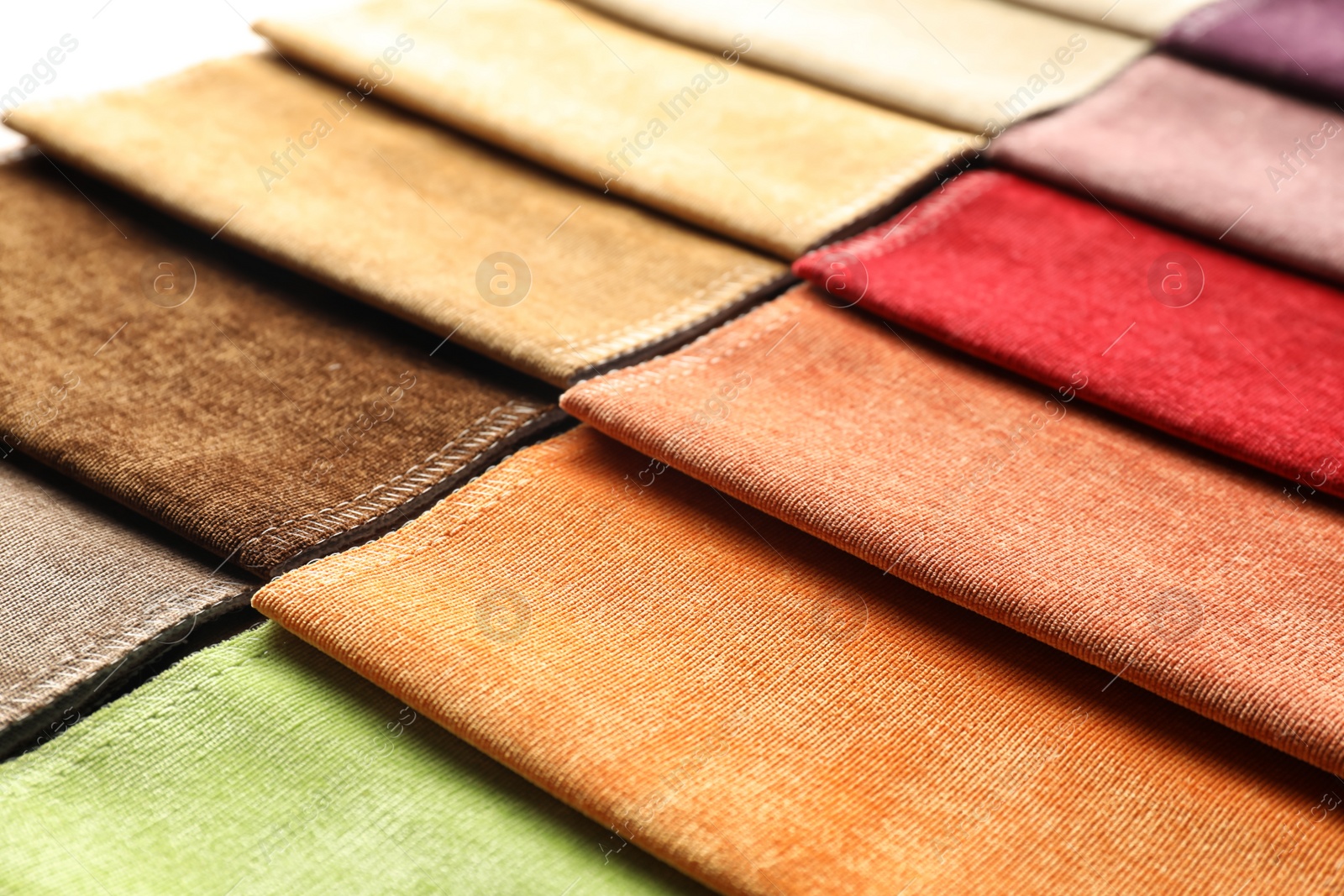 Photo of Fabric samples of different colors for interior design as background