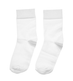 Photo of New socks on white background, top view