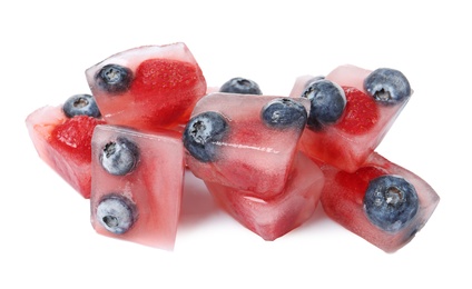 Photo of Ice cubes with berries on white background