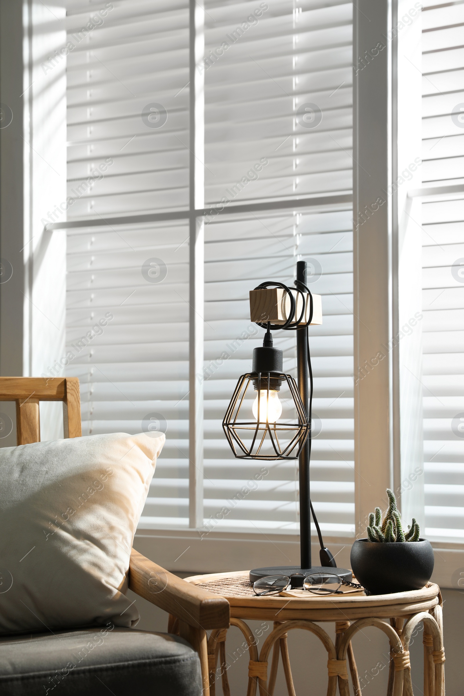 Photo of Room interior with stylish lamp and furniture