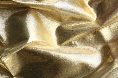 Photo of Texture of beautiful golden fabric as background, closeup