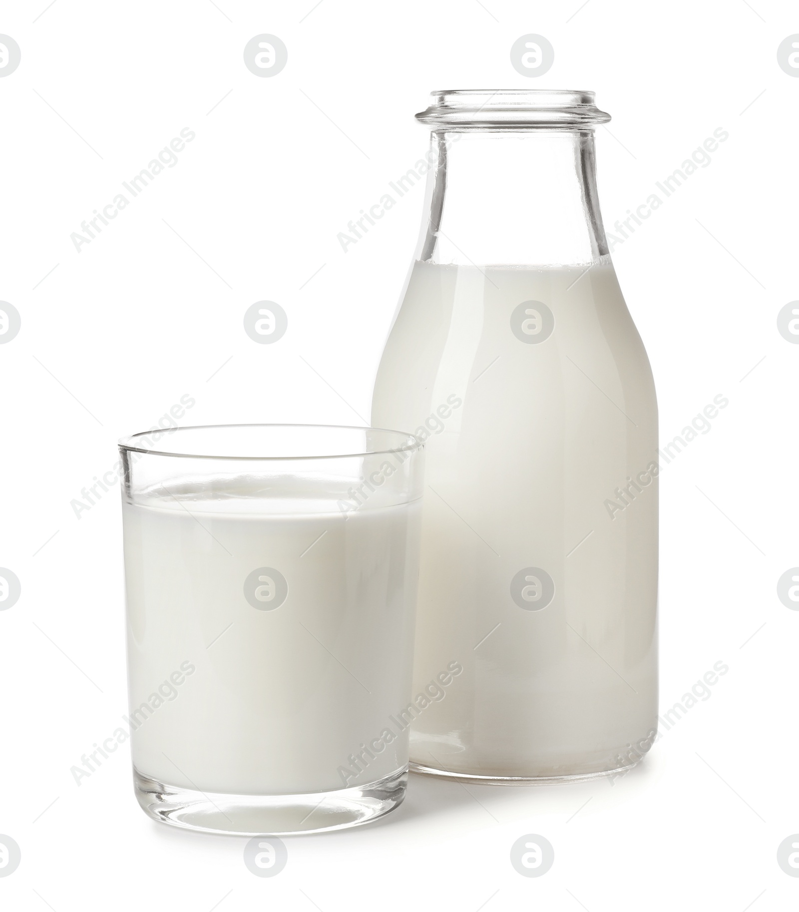 Photo of Glass and bottle with fresh milk on white background