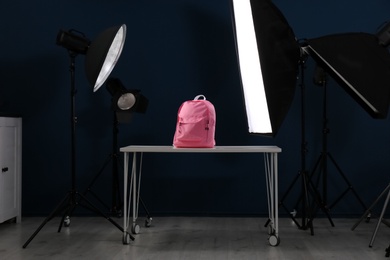 Photo of Shooting of bright backpack for product promotion in photo studio