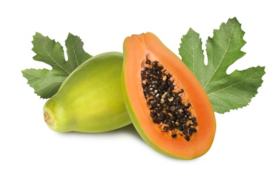 Fresh ripe papaya fruits and green leaves on white background