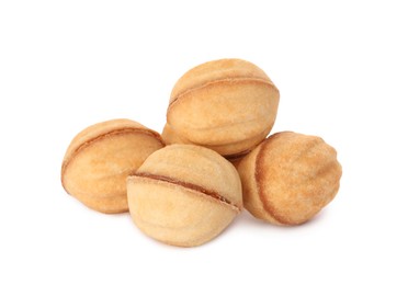 Photo of Delicious nut shaped cookies with condensed milk on white background