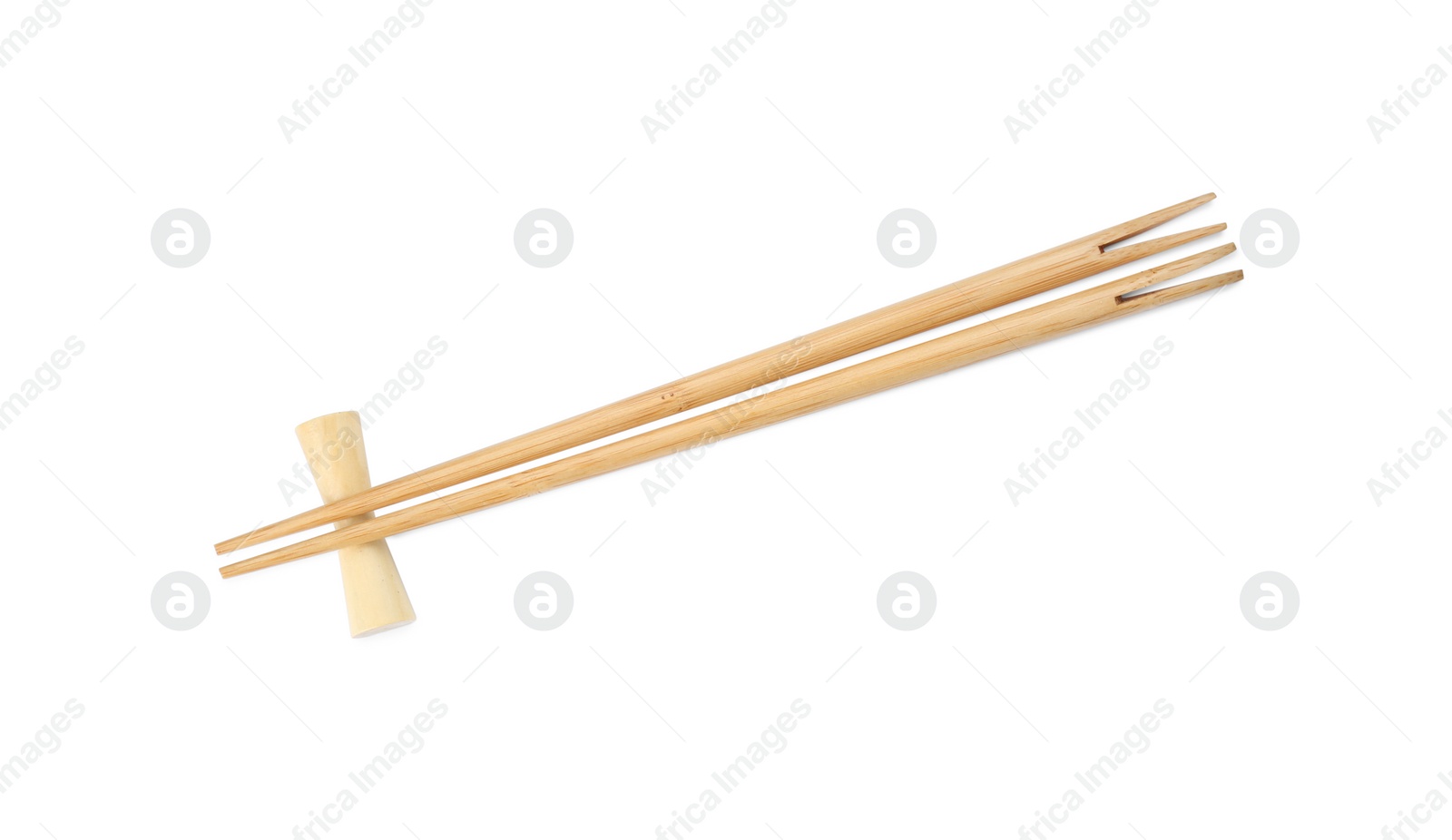 Photo of Pair of wooden chopsticks with rest isolated on white, top view