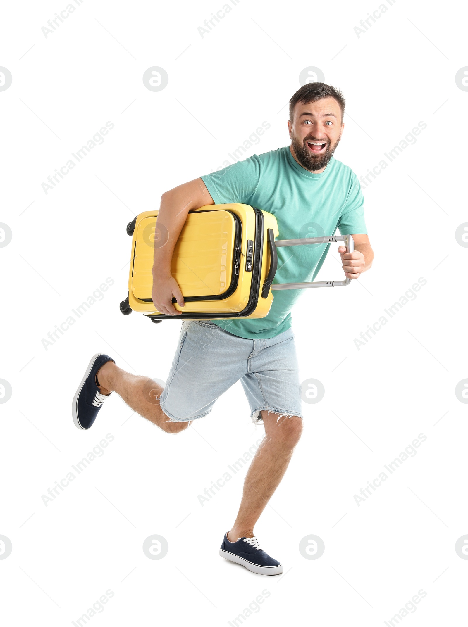 Photo of Man with suitcase running on white background. Vacation travel