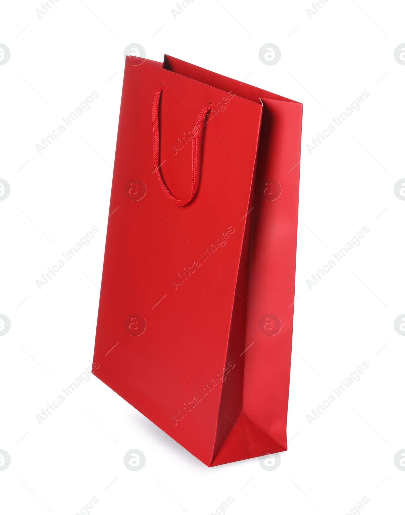 Photo of One red shopping bag isolated on white