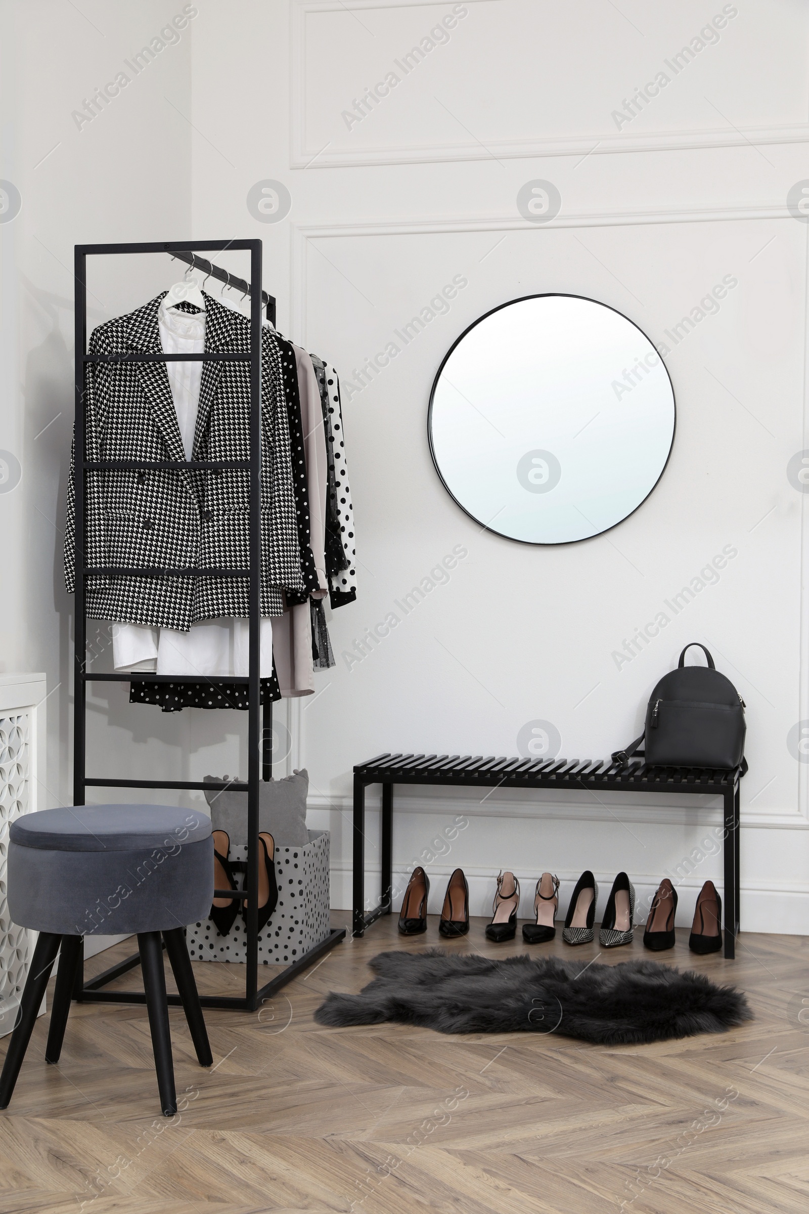 Photo of Dressing room with stylish clothes, shoes and accessories. Elegant interior design