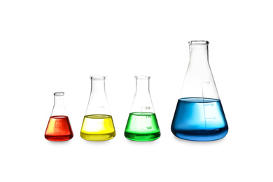 Different laboratory glassware with colorful liquids isolated on white