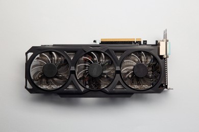 Photo of One graphics card on color background, top view