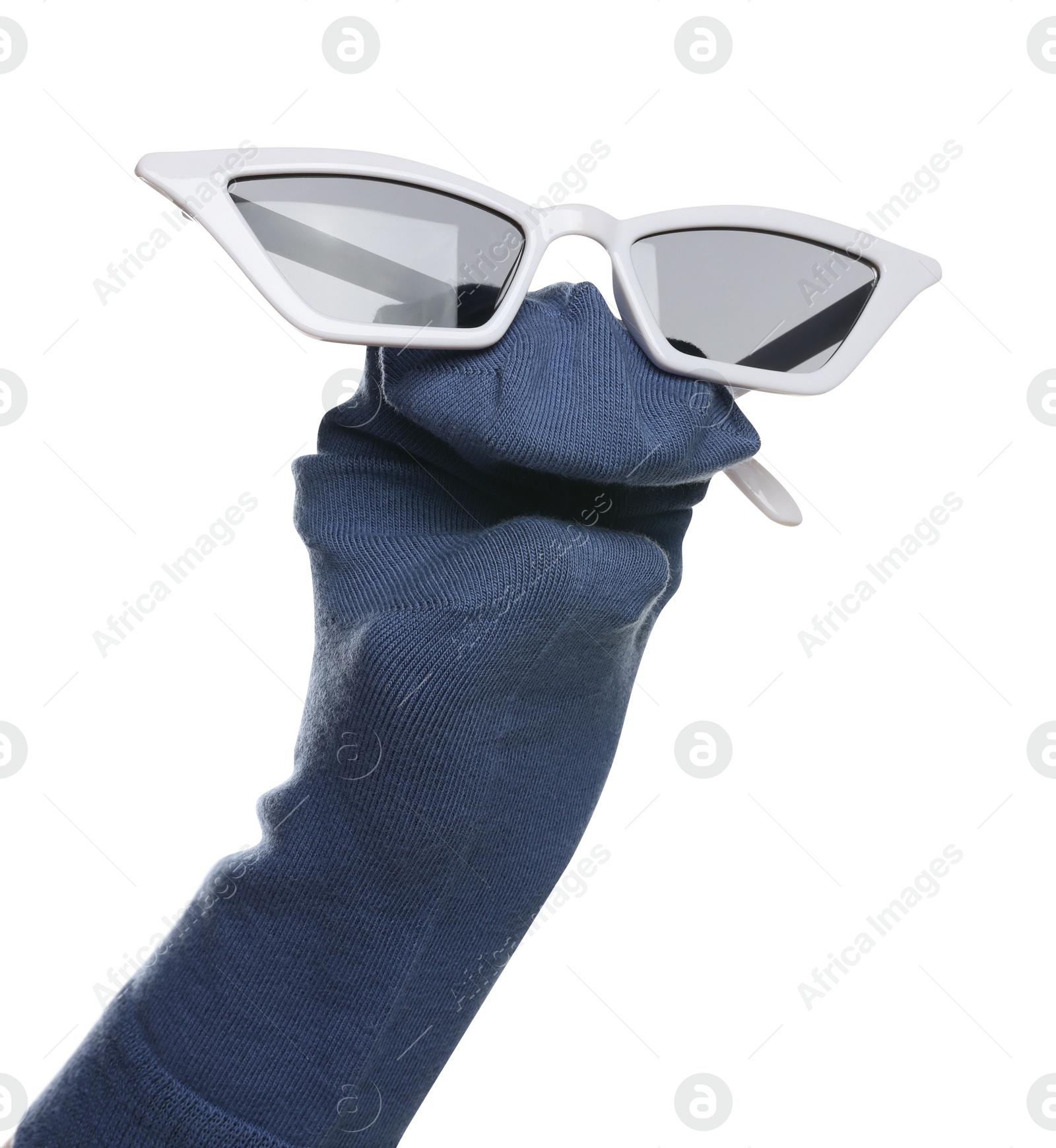 Photo of Funny sock puppet with sunglasses isolated on white