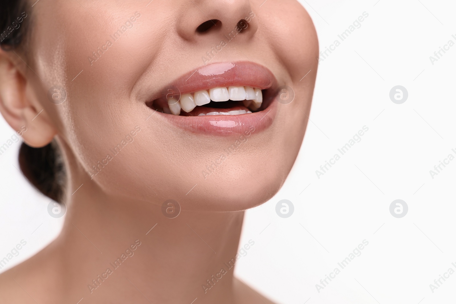 Photo of Woman with beautiful lips smiling on white background, closeup. Space for text