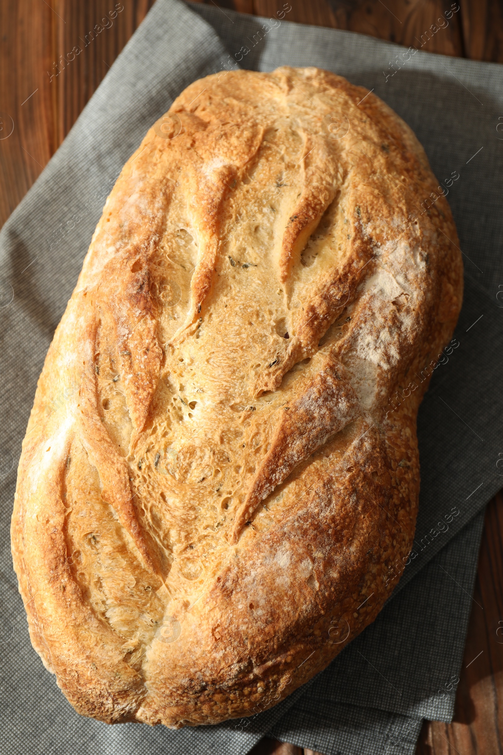 Photo of Freshly baked sourdough bread on wooden table