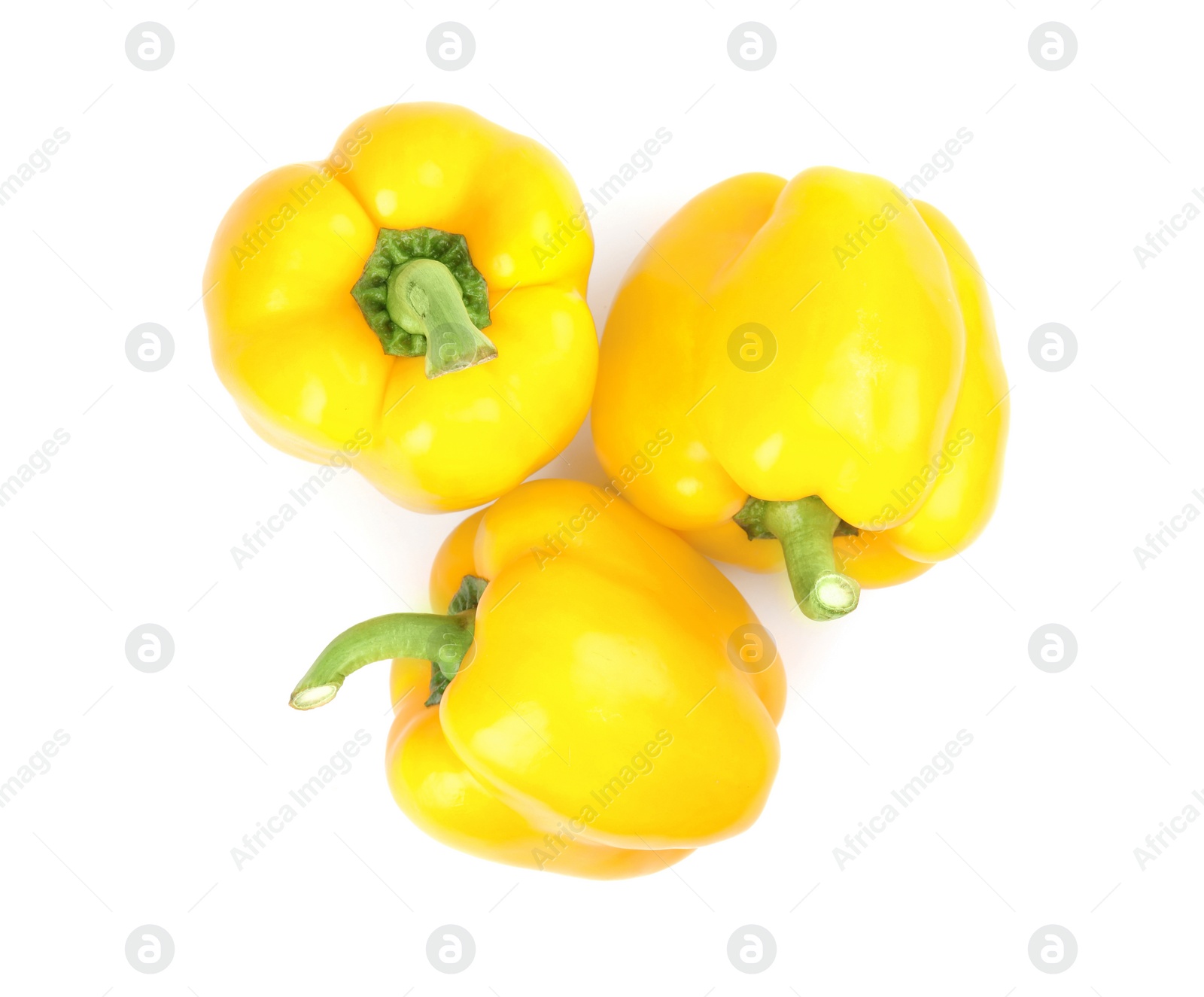 Photo of Ripe yellow bell peppers isolated on white, top view